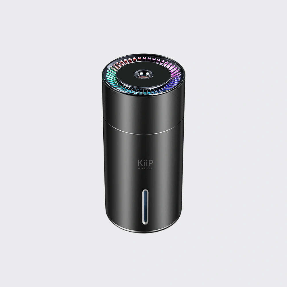Black humidifier with colorful light on top on a white background