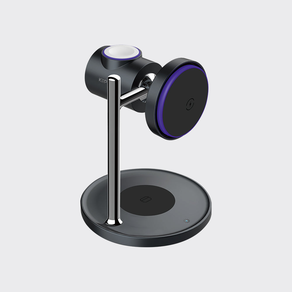 A modern magnetic wireless charging stand with a black circular base, a vertical chrome stand arm, and a charging head featuring a purple magnetic ring and a white charging pad, shown on a light gray background.