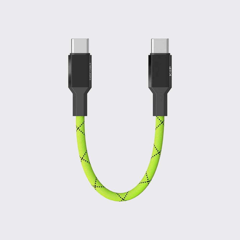 A U-shaped USB-C to USB-C charging cable with a bright neon green braided strap and black connector housings, shown on a light gray background.