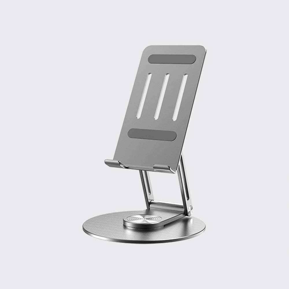 A minimalist silver metal phone stand with a circular base and adjustable slotted backplate, shown on a light gray background.
